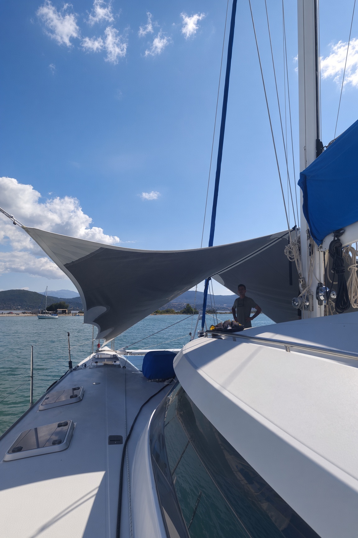 A shade sail over the deck of a catamaran.