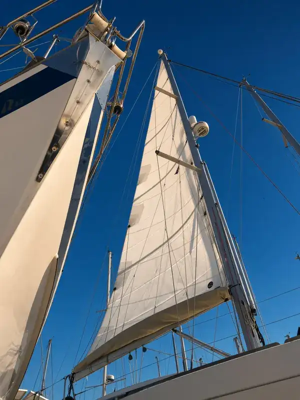 A sail set on the mast of a yacht.