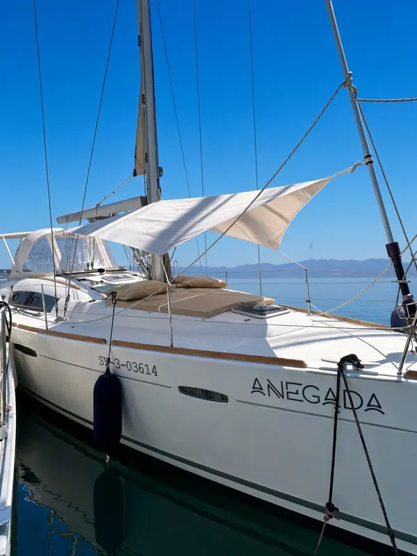 A shade sail set over the deck of a sailing yacht.